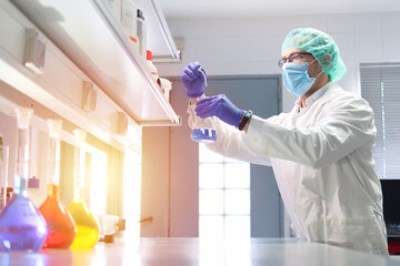 Scientist Conducting Experiment in Laboratory Setting