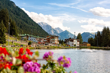 Madonna di  Campiglio, Italy - August 21,2024 - lake Laghetto among the mountains in the village,  one of the Trentino, Brenta Dolomites ski resort.