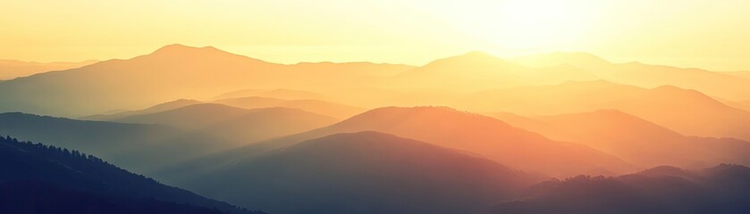 A breathtaking view of rolling mountains bathed in the soft glow of sunrise, capturing the serenity of nature at dawn.