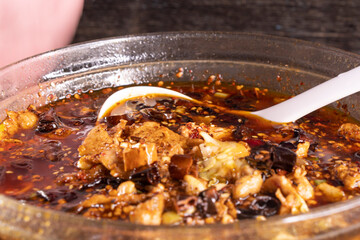 Sichuan Chongqing Soup on wood table. Chinese food.