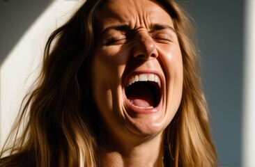 upset Caucasian woman screaming, crying in pain. shock and emotional breakdown, depression.