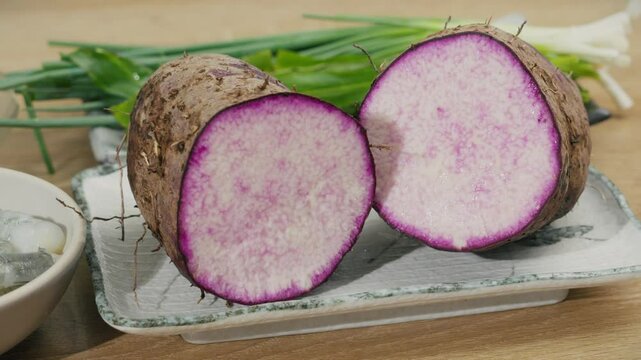 Close-up Footage of Fresh Purple Yam (Dioscorea Alata) - Vibrant Purple Root Vegetable Perfect for Asian Cuisine and Healthy Recipes