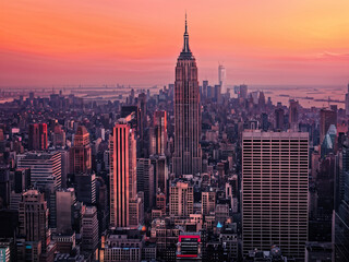 Vibrant city Skyline at Noon with Orange and Pink Sky Background. 