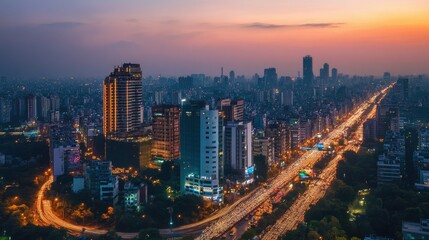 Fototapeta premium A cityscape of a modern Indian metropolis at dusk, with tall buildings, traffic, and illuminated streets.