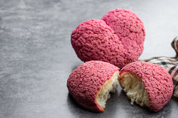 Heart shaped Choux biscuits with cream filling on gray background