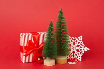 Small christmas trees with decoration on color background
