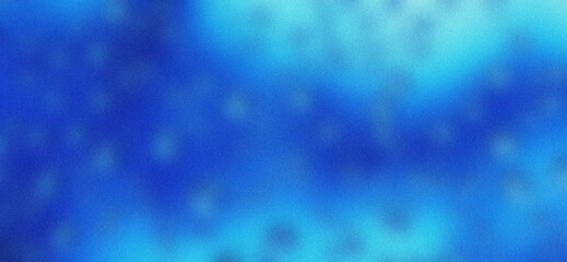Blurred background of water drops on blue background with grainy texture