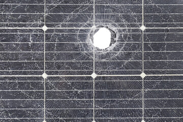 The solar panel is broken and has holes.
