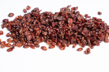 Red dried barberry on white background