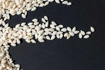 Macro kernels of white roasted sesame seeds.