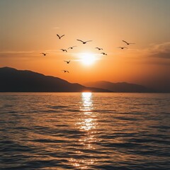 Obraz premium Sunset over the water with birds flying against sunlight on the Mediterranean Sea 