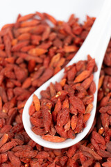 Dried Goji berries Lycium barbarum in a spoon