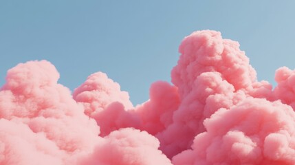 Soft, fluffy pink clouds float gracefully in a clear blue sky, creating a dreamlike atmosphere in the evening light