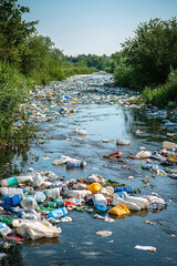 Polluted River,  A grim scene of a dirty river filled with floating trash, highlighting the harmful effects of pollution and human activity on the environment
