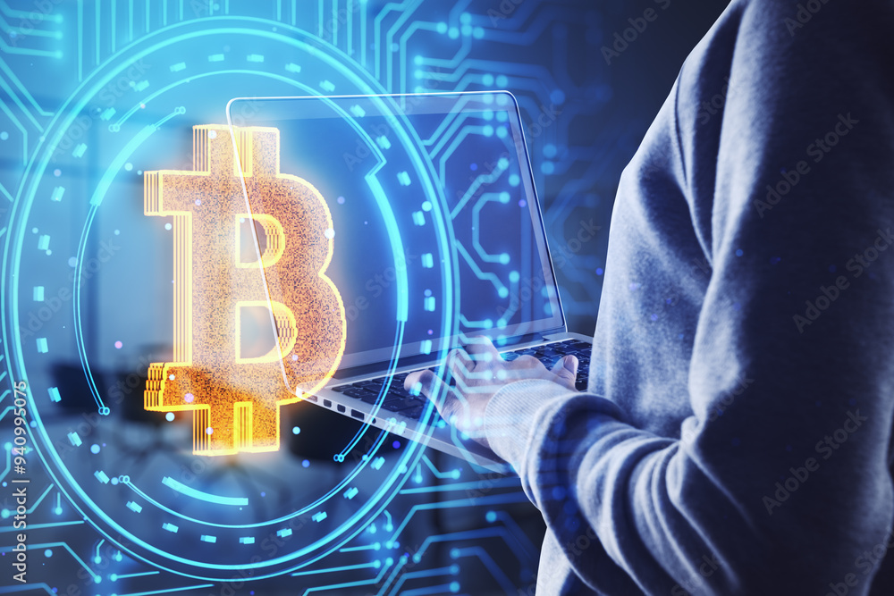 Aufkleber Side view of hacker hands using laptop with glowing digital bitcoin in circular tech hologram on blurry background. Cryptocurrency concept. Double exposure.