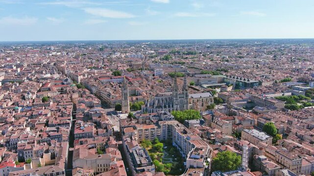 Bordeaux, France: Aerial view of famous French historic city, cathedral Cath&eacute;drale Saint-Andr&eacute; de Bordeaux and Pey Berland Tower, summer day with blue sky - landscape panorama of Europe from above
