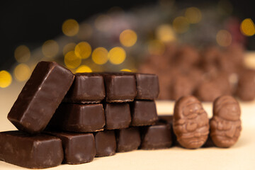 Christmas chocolates on the background of a garland