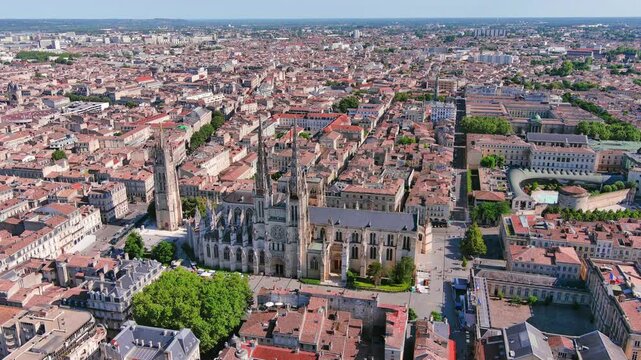 Bordeaux, France: Aerial view of famous French historic city, cathedral Cath&eacute;drale Saint-Andr&eacute; de Bordeaux and Pey Berland Tower, summer day with blue sky - landscape panorama of Europe from above
