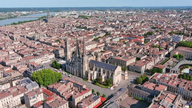 Bordeaux, France: Aerial view of famous French historic city, cathedral Cath&eacute;drale Saint-Andr&eacute; de Bordeaux and Pey Berland Tower, summer day with blue sky - landscape panorama of Europe from above
