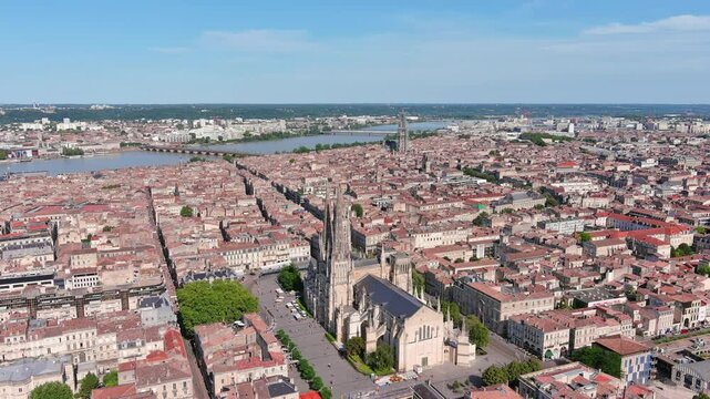 Bordeaux, France: Aerial view of famous French historic city, cathedral Cath&eacute;drale Saint-Andr&eacute; de Bordeaux and Pey Berland Tower, summer day with blue sky - landscape panorama of Europe from above
