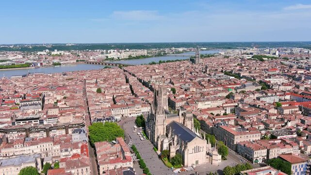Bordeaux, France: Aerial view of famous French historic city, cathedral Cath&eacute;drale Saint-Andr&eacute; de Bordeaux and Pey Berland Tower, summer day with blue sky - landscape panorama of Europe from above
