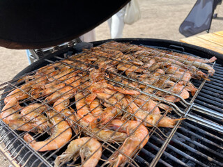 Many shrimps on grill bbq prepairing prawn