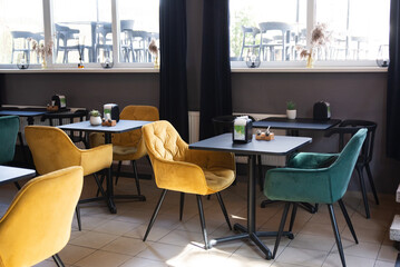 Free restaurant chairs green and yellow before opening. Kaunas