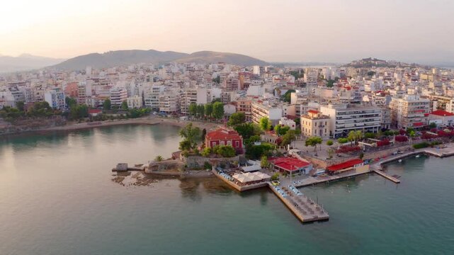 4k drone forward video (Ultra High Definition) of Chalcis town. Stunning morning seascape of Aegean sea, North Euboean Gulf. Impressive summer scene of Euboea island, Greece, Europe.