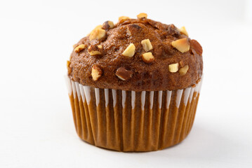Chocolate almond muffin on white background