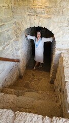 Beautiful girl in a Russian shirt near the Kremlin. Pskov	
