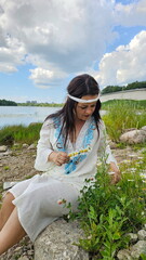 Beautiful girl in a Russian shirt near the Kremlin. Pskov