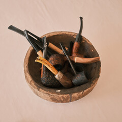 African wooden bowl and a set of ancient pipes