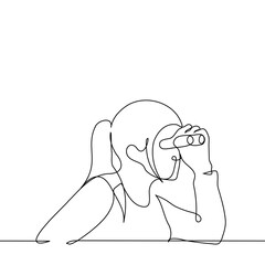 woman looking through binoculars - one line art vector. concept theater spectator, spy