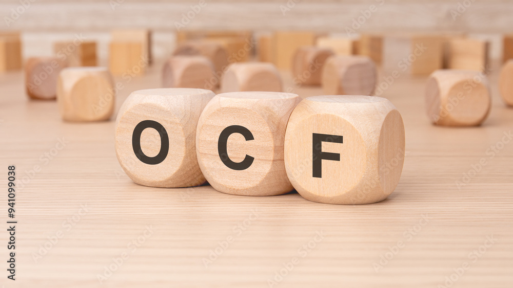Poster wooden blocks that are displaying the ocf letters uniquely arranged and vibrant in color