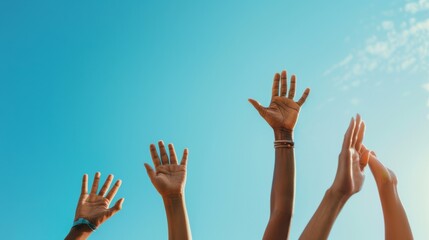 Hands raised against a clear blue sky, embodying freedom, unity, and celebration in a vibrant and uplifting scene.