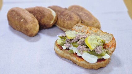 Fricasse with Tuna, Pickled Lemon, Hard-Boiled Egg, Harissa, Olives, and Pickles – פריקסה Tunisian Treat