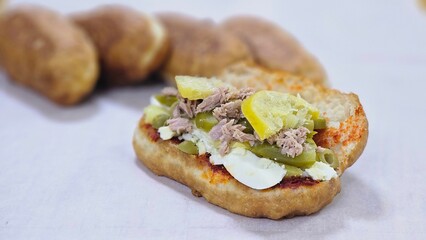 Fricasse with Tuna, Pickled Lemon, Hard-Boiled Egg, Harissa, Olives, and Pickles – פריקסה Tunisian Treat