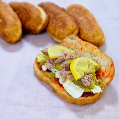 Fricasse with Tuna, Pickled Lemon, Hard-Boiled Egg, Harissa, Olives, and Pickles – פריקסה Tunisian Treat