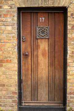 House door number 17 on an old wooden front door