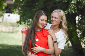 Fototapeta premium Two young women blonde and brunette