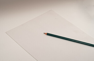 pencil and white paper in white background