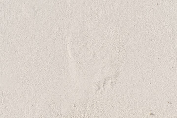 Cream peeling paint concrete wall texture background. Rough and grunge texture. Uneven stucco cement wall background.