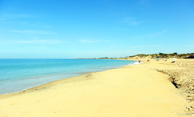 Fototapeta premium Punta Candor beach, wild golden sand beach in Rota, province of Cadiz, Andalusia, Spain. Beaches of Rota, Coast of Light Cadiz.