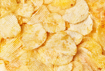 Close-up of Crispy Ridged Potato Chips Background Texture for Snack Advertising