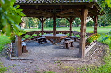 Large wooden gazebo shelter example. Gazebo with outdoor furniture.