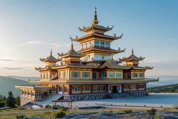 Fototapeta premium A large building with many windows sits atop a hill, offering panoramic views