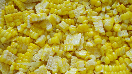 Ripe corn background. Close-up yellow corn texture for freshness, food texture, abstract yellow, cut, cooking, fiber, eating healthy, and top view concepts. Food texture background of sweet corn.