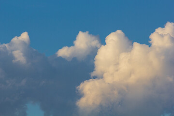 Sunset with clouds in the sky over a modern city.