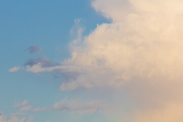 Sunset with clouds in the sky over a modern city.