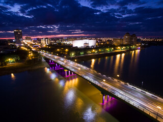 Fototapeta premium Night Bridge over Illuminated Ural River in Atyrau
